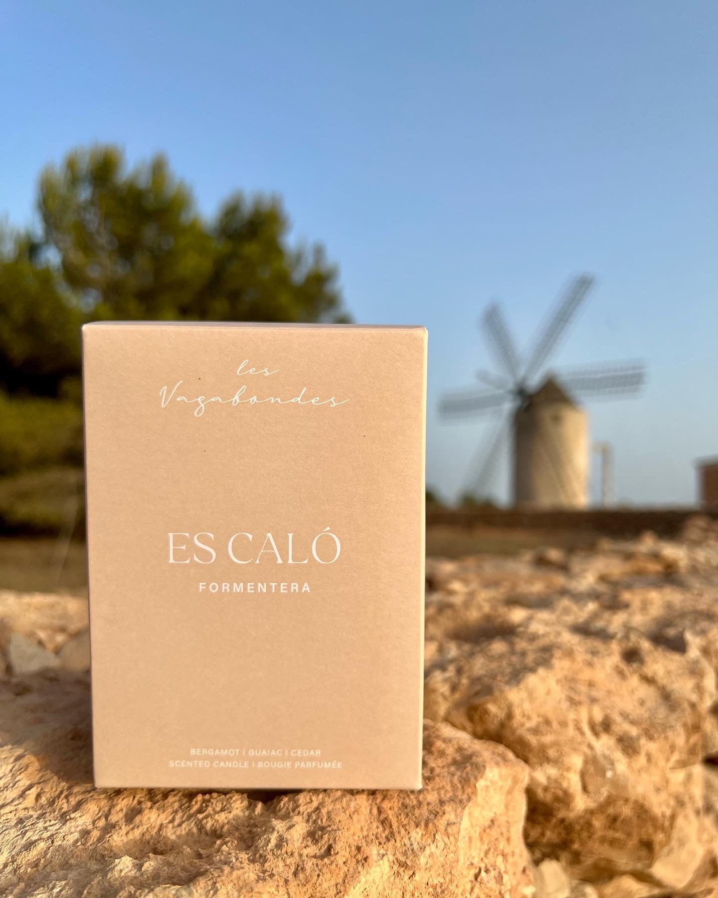 Es Calo candle box on top of a rustic wall, in front of a Formentera landscape